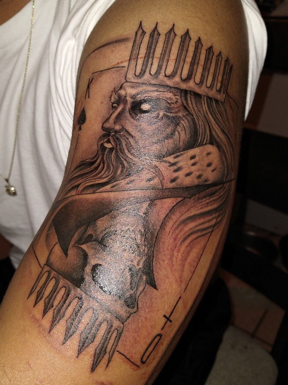 King of spades tattoo on the wrist