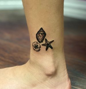 Seashell, starfish, and sand dollar on the ankle