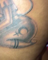 Female Bust and Symbol Tattoo