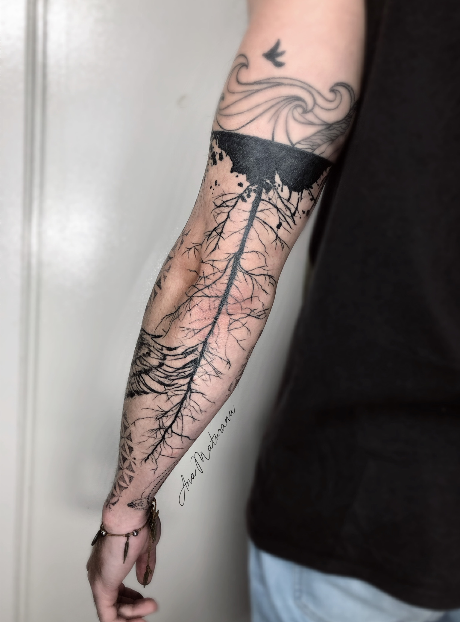 Tattoos Elegantly Combine Delicate Natural Subjects with Bold Geometry