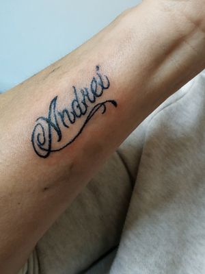 Name tattoo on arm