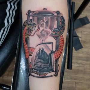 Mashup featuring Photorealism hourglass and grim reaper with traditional cobra.
