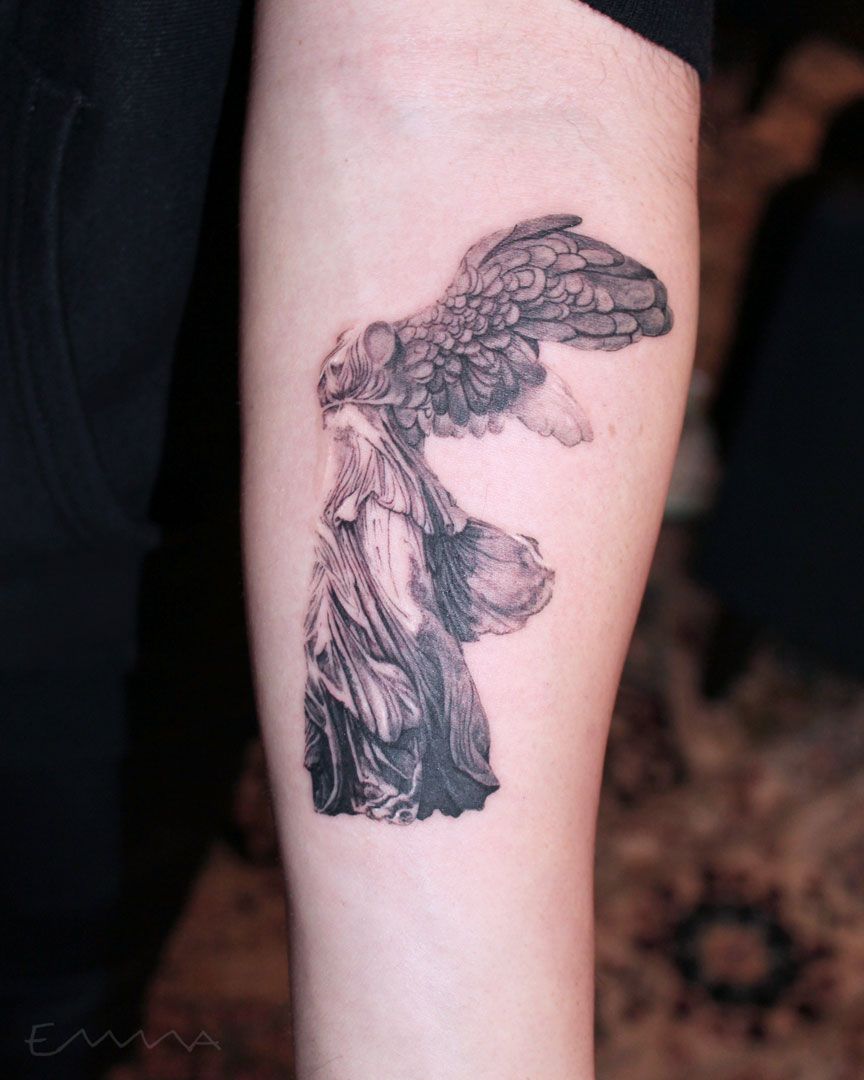 Winged Victory of Samothrace tattoo on the right upper