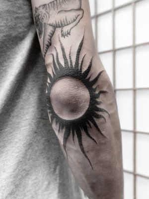 Blackwork sun tattoo
