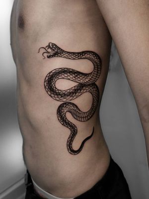 Snake tattoo on ribs