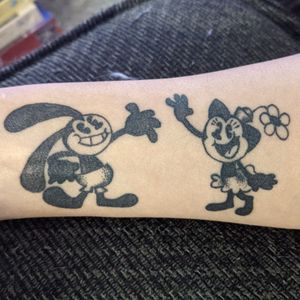 Oswald the Lucky Rabbit and his girl, Orstensia the Cat in retro rubberhose cartoon style. Done by Sarah Scharf at Black Buffalo Tattoo Collective in Rocklin.