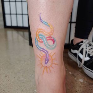 Colorful snake tattoo by mccollester.cattoos #mccollestercattoos #snake #color #watercolor #pastel #sun #minimal 