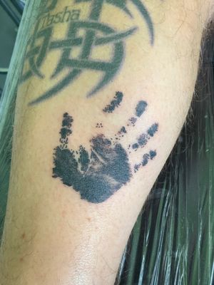 Hand print tattoo of the clients grandson