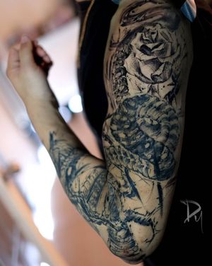 montreal-Sketch-style-snake-and-rose-full-sleeve-tattoo