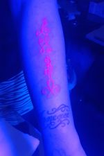 Bloodline fluorescent red tattoo