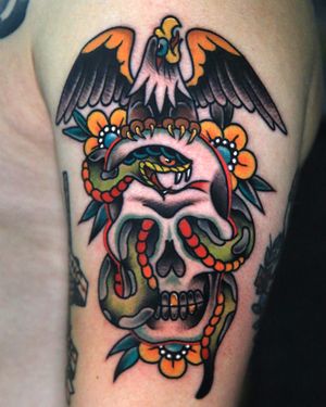 Traditional eagle skull snake tattoo.