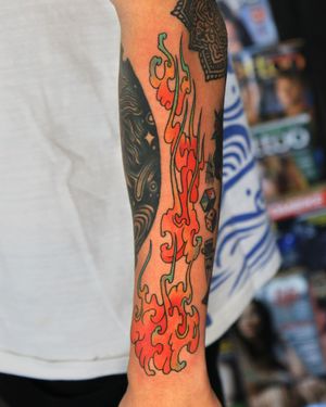 Oriental fire drawing tattoo.