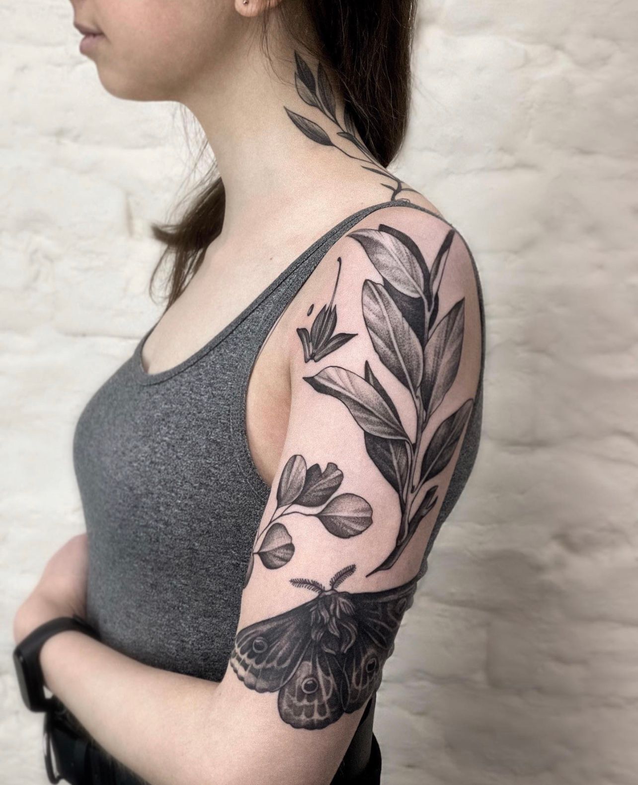 Microrealistic ginkgo leaves tattoo on the shoulder