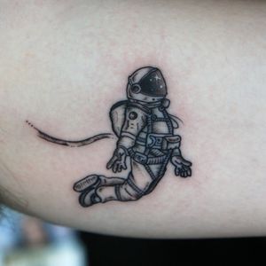 Astronauts black work tattoo.