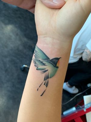 Small bird tattoo.