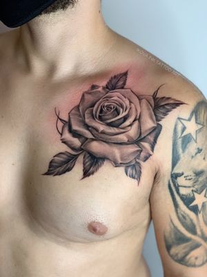 Rose chest tattoo 