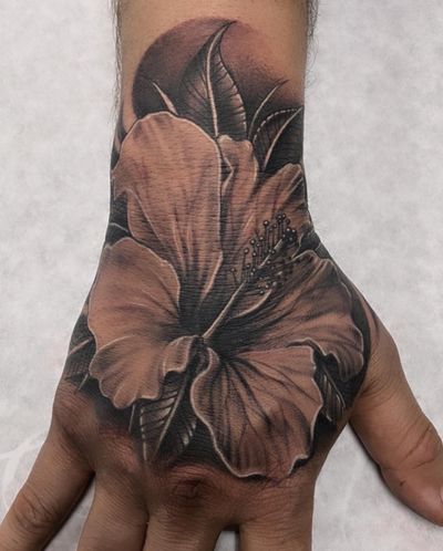 Hibiscus hand tattoo. 