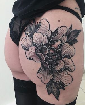 Elegant blackwork tattoo featuring a delicate flower motif by artist Giada Knox. Perfect for those looking for a minimalist yet striking design.