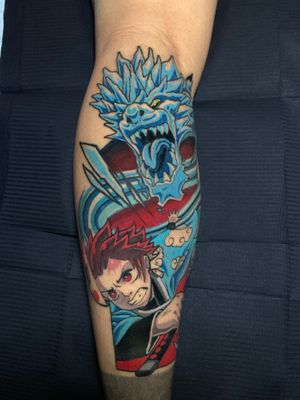 Demon Slayer tattoo on the back of the calf 