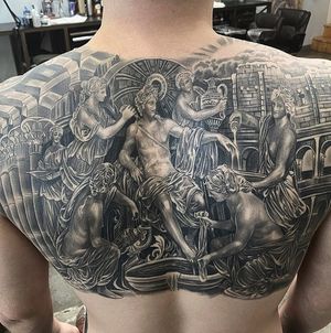 Express your faith with this stunning black and gray angel tattoo by Jake Masri, beautifully placed on your upper back.