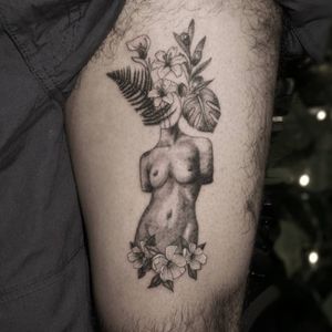 Female body with flowers and plants