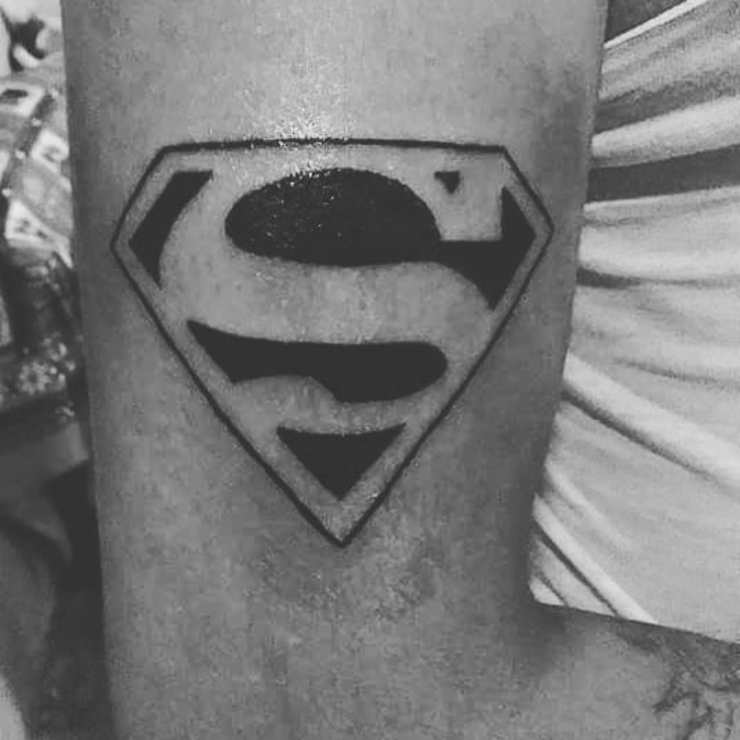 black and white superman tattoo