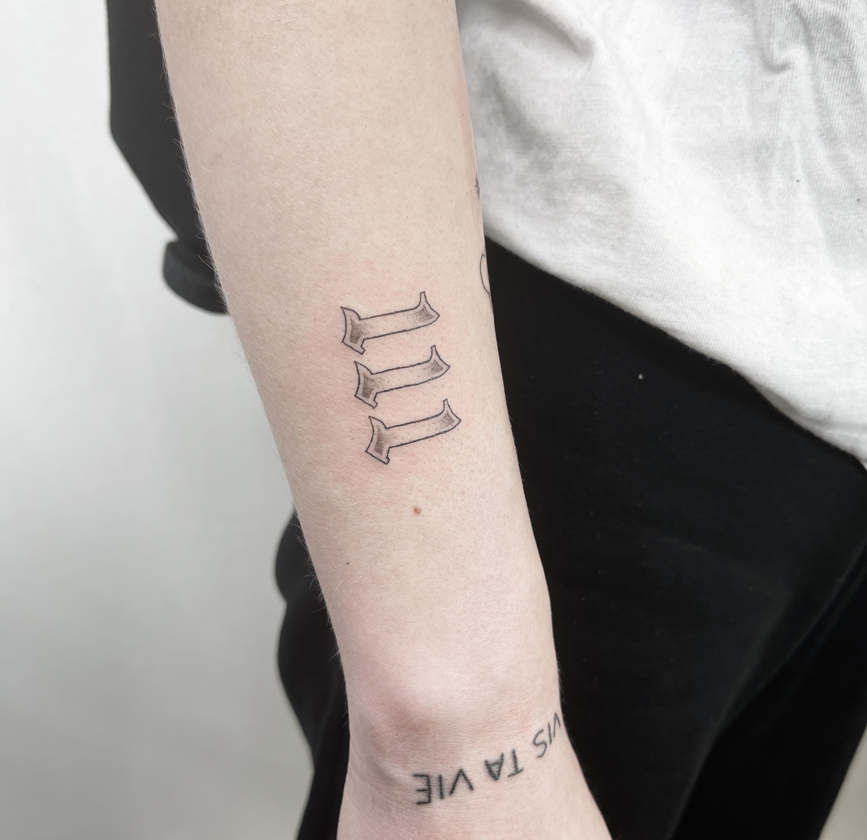 Number 1111 tattooed on the wrist