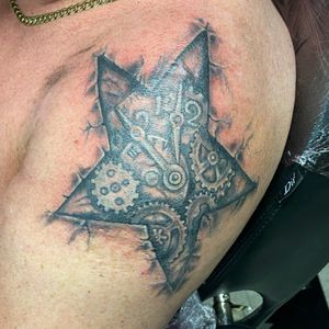 Star Clock in skin tattoo 