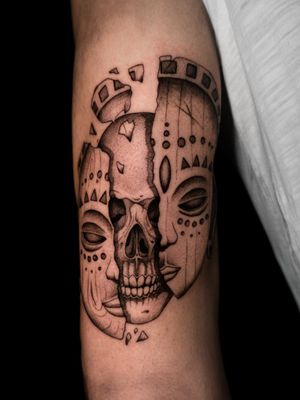Skull and african mask tattoo