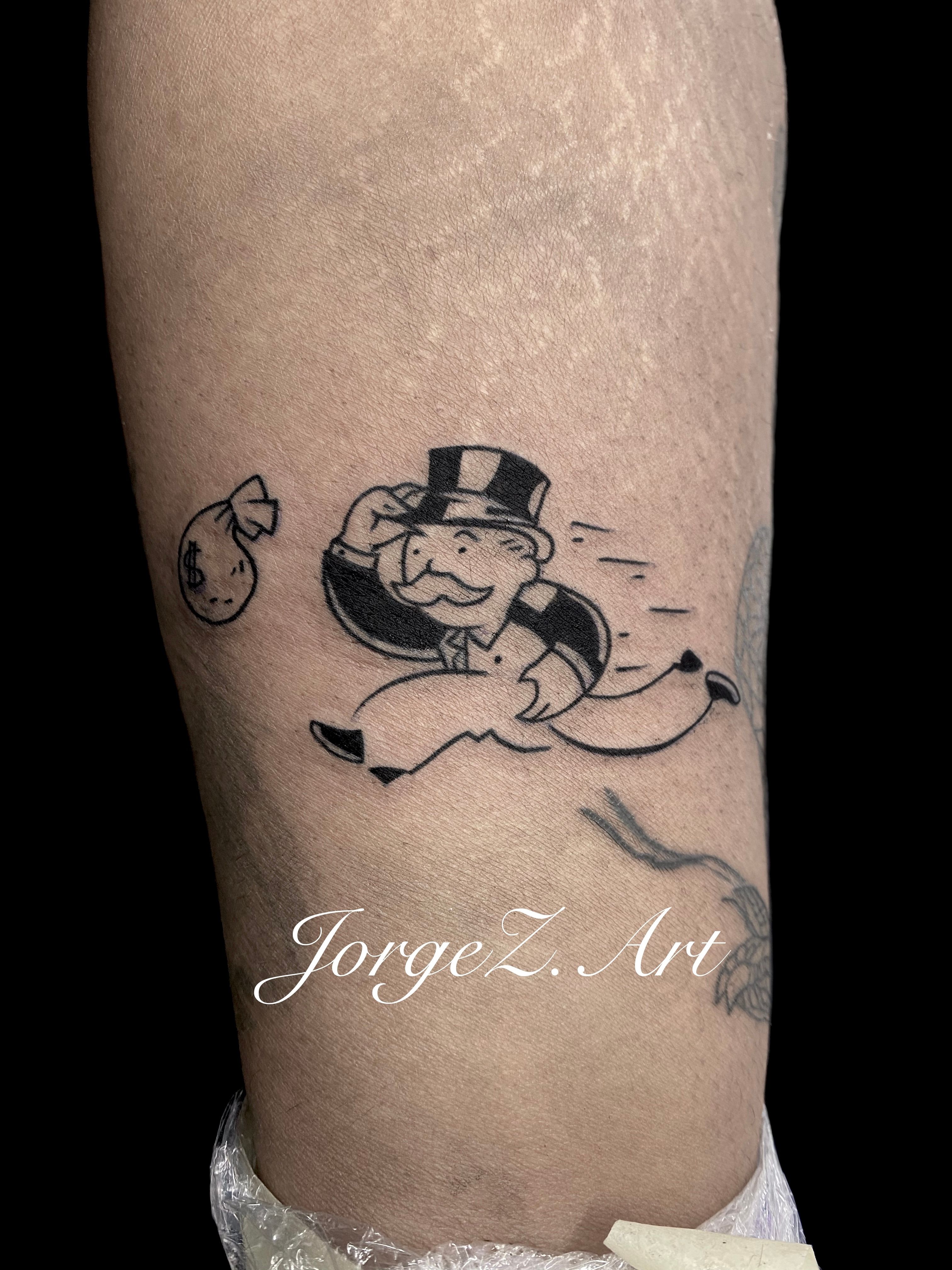 monopoly man tattoo