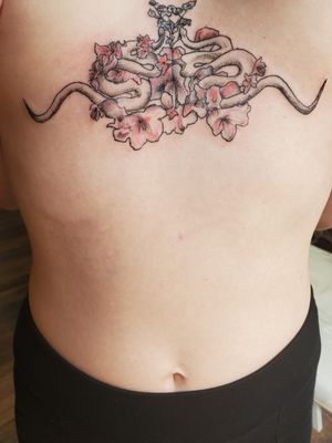 Sternum Floral piece by Momo.Tattoos