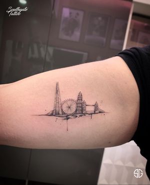 • London • custom miniature skyline by @o.s.c.r.tttst for lovely @meliz.xx done @southgatetattoo. Small designs are always welcome at the studio! For bookings and inquiries with SG team:•📧 info@southgatetattoo.co.uk •🌐 https://southgatetattoo.co.uk•📱07456415895‬(WhatsApp only) •📞 02083516330••••••••#london #skyline #singleneedletattoo #miniaturetattoo #blackworktattoo #smalltattoo #southgatetattoo #sgtattoo #sg #tinytattoos #southgate #enfield #londontattooartist #londontattoostudio 