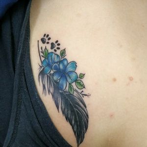 Coverup tattooFeather with flowers
