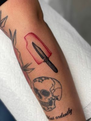 Unique and eye-catching blackwork and neo-traditional style tattoo featuring a knife and ice cream design by Miss Vampira. Perfect for bold statement piece.