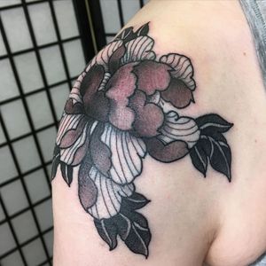 Exquisite blackwork peony tattoo by Kiko Lopes, beautifully adorning the shoulder.