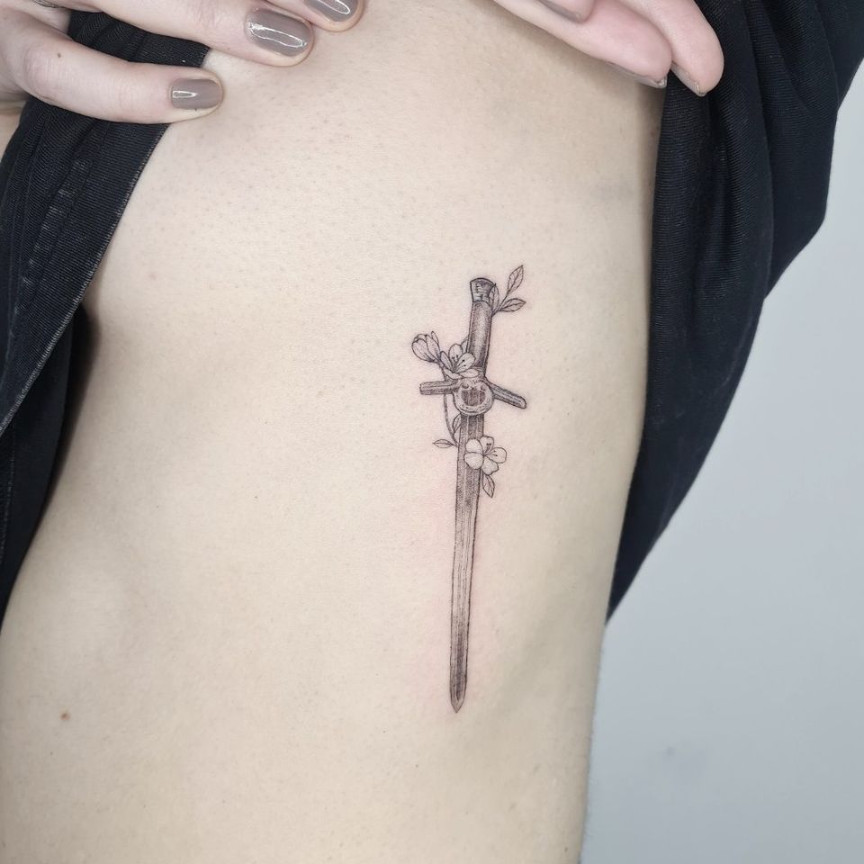 Fineline sword by David Baker #DavidBaker #fineline #sword #floral #floraltattoo #singleneedle