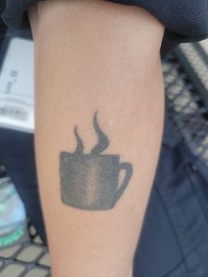 Coffee cup. Part 2 of a couples tattoo, my husband has the tilted coffee cup. When we hold hands his pot pours into my cup