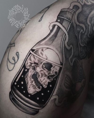 Unique black and gray illustrative tattoo by Alejandro Gonzalez, featuring a skull and bottle design.