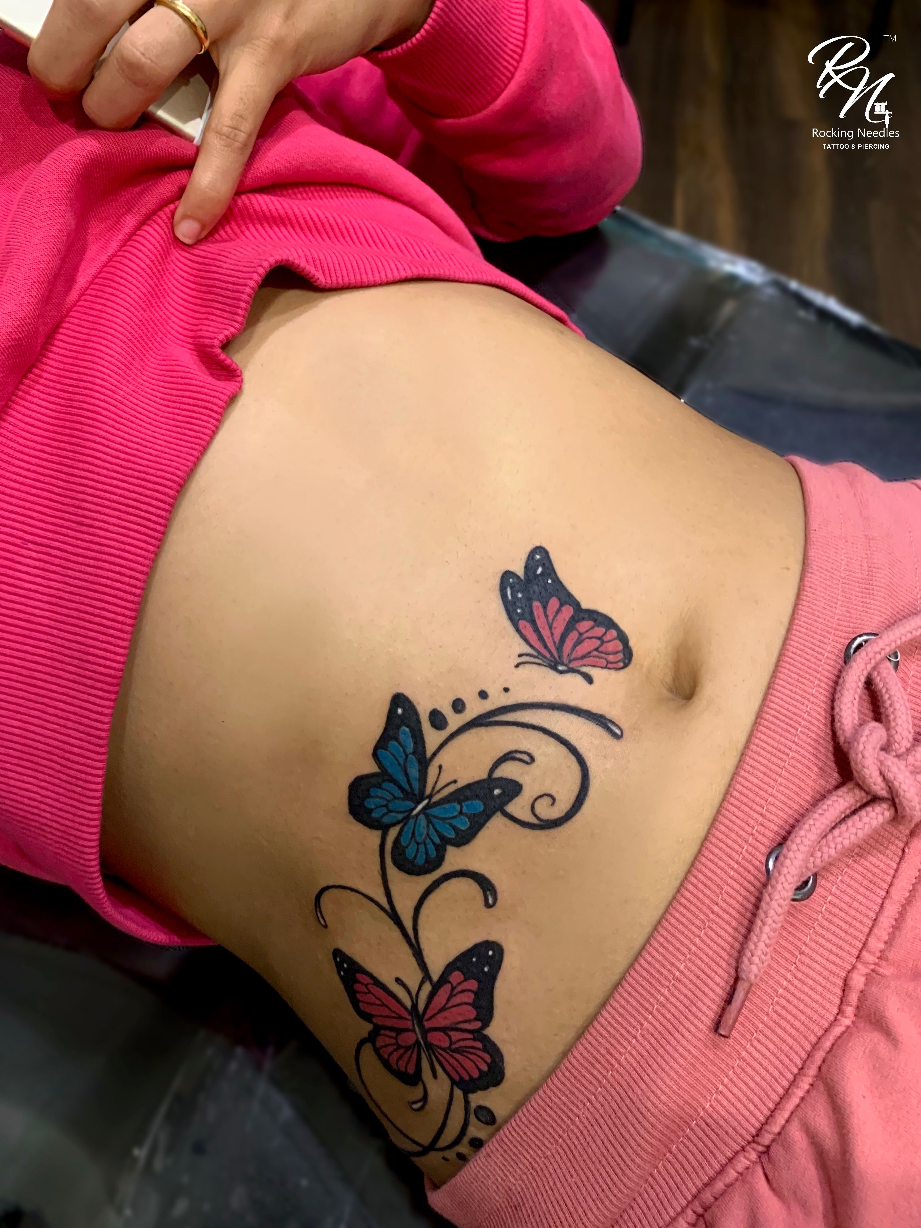 Butterfly tattoo on the hip 