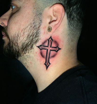 Illustrative cross design on the neck by Felipe Reinoso, combining bold lines and intricate details.