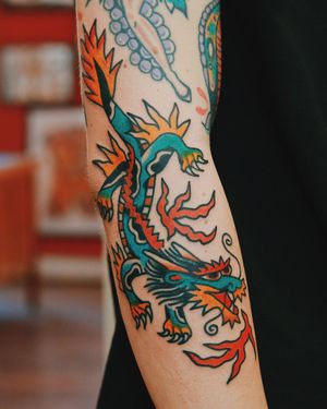 Get a fierce and detailed Japanese dragon tattoo on your arm in London. Stand out with this traditional design.