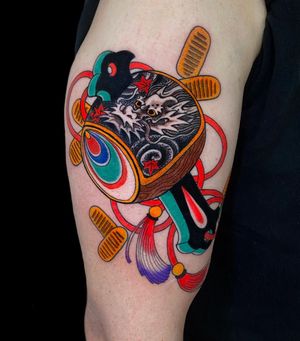 Get a powerful Japanese dragon and the lucky hammer Uchide no Kozuchi tattooed on your upper leg in London, GB.