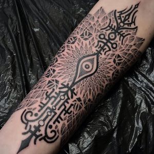 Explore intricate dotwork mandala design on your forearm in London, GB. Perfect fusion of geometry and spirituality.