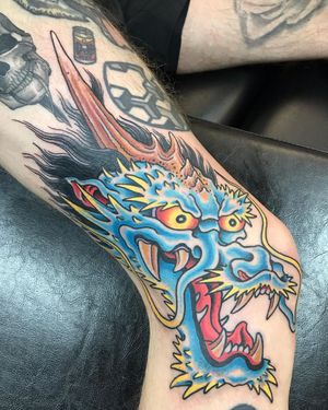 Get a fierce and striking Japanese dragon tattoo on your knee in London. Embrace the power and mystique of this ancient motif.