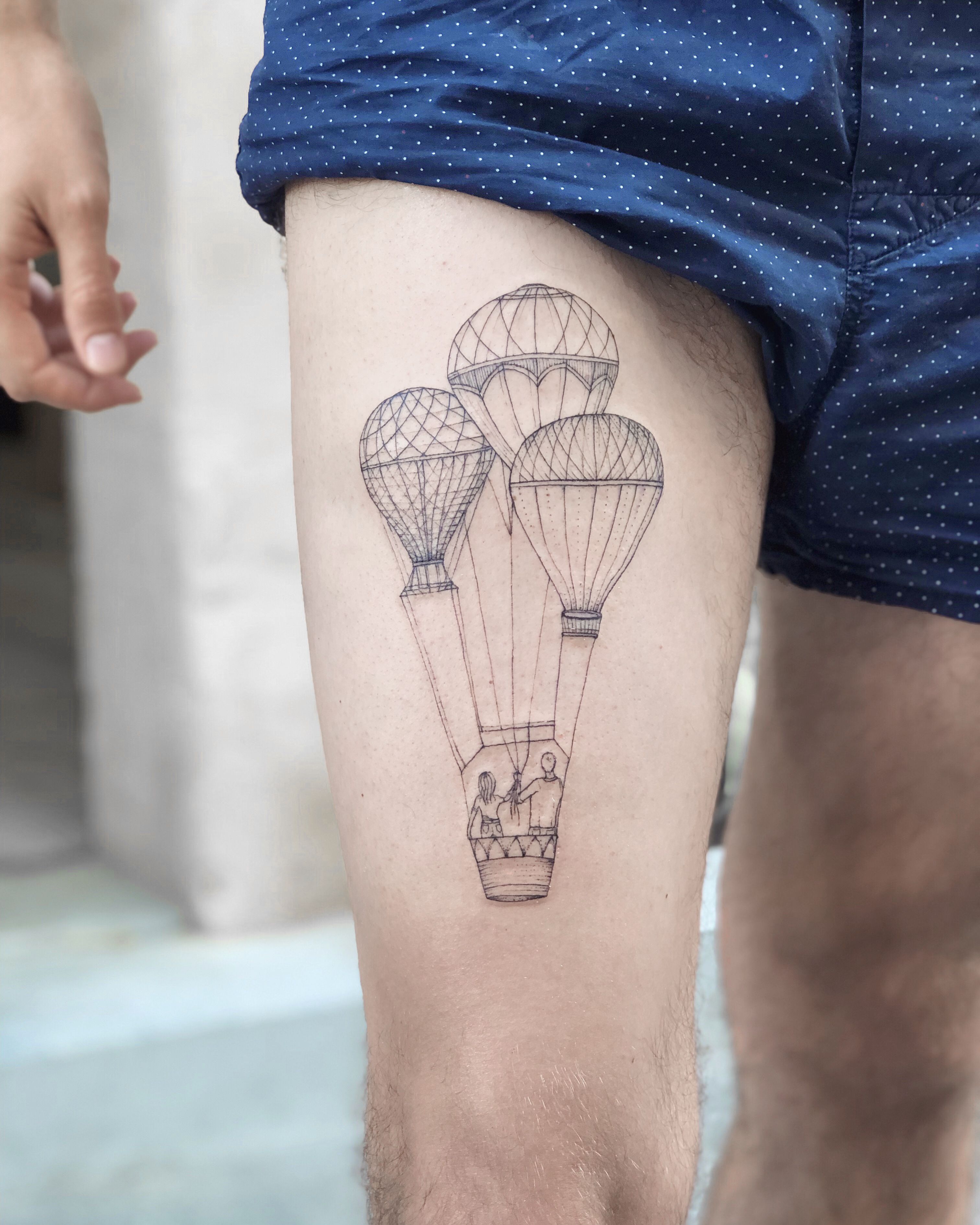 Hot air balloon tattoo on the inner arm