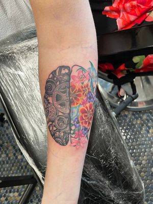Brain tattoo for her kiddo, inspired by his struggles and how the 2 sides work. 