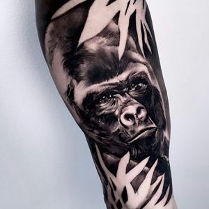 Get a bold and realistic gorilla tattoo in blackwork style on your arm in Los Angeles for a truly unique look.