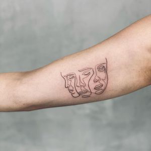 Get a beautiful illustrative woman tattooed on your upper arm in Los Angeles for a unique and stylish look.
