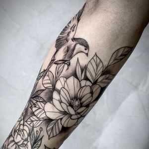 Get a stunning blackwork flower tattoo on your forearm in Los Angeles. Unique, illustrative design.