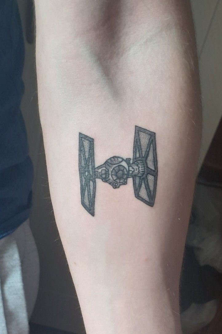 Minimalist Tie Fighter Tattoo  Fighter tattoo Fandom tattoos Meaningful  symbol tattoos